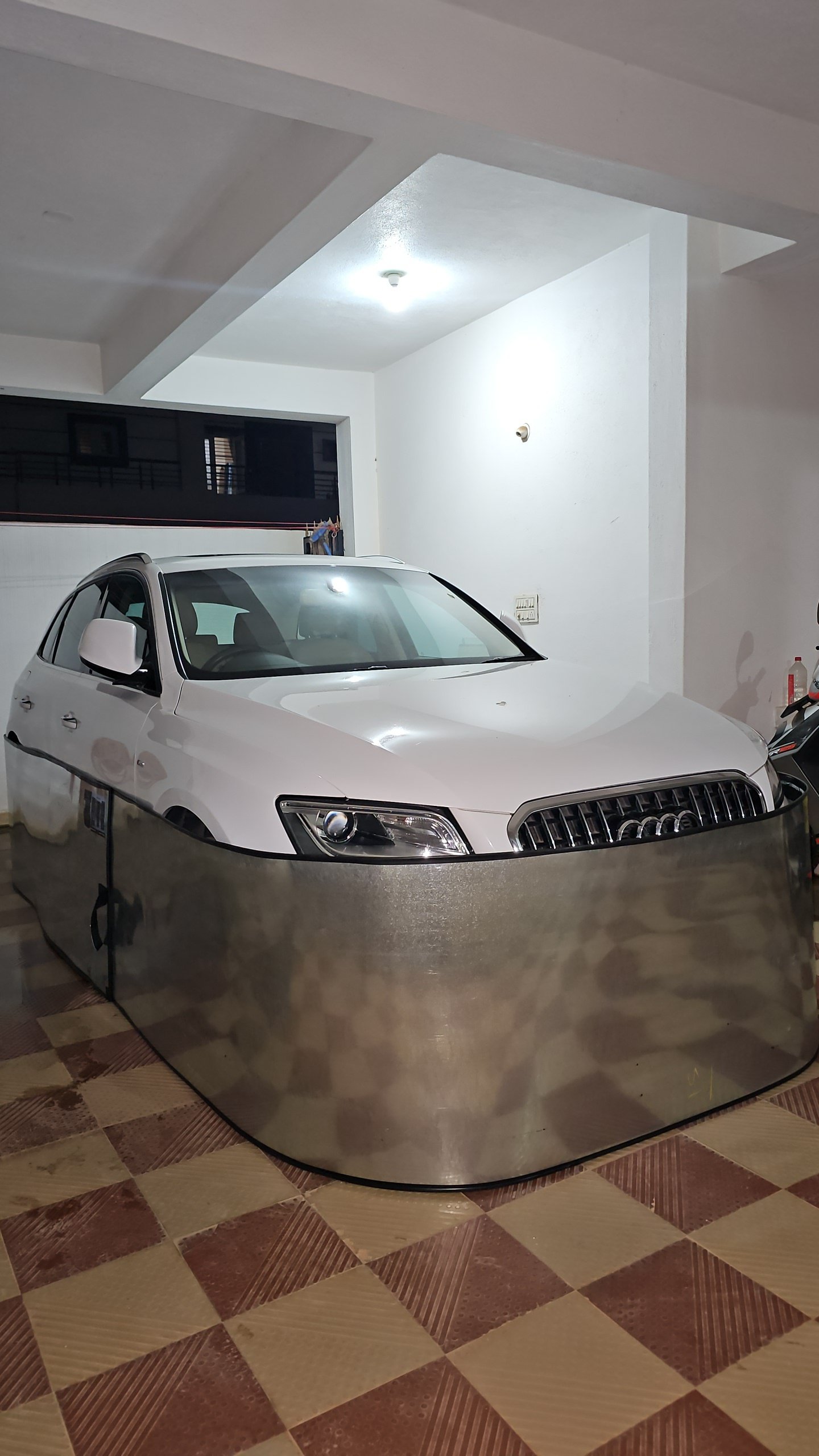 Car-lungi rat guard deployed around car in covered apartment parking