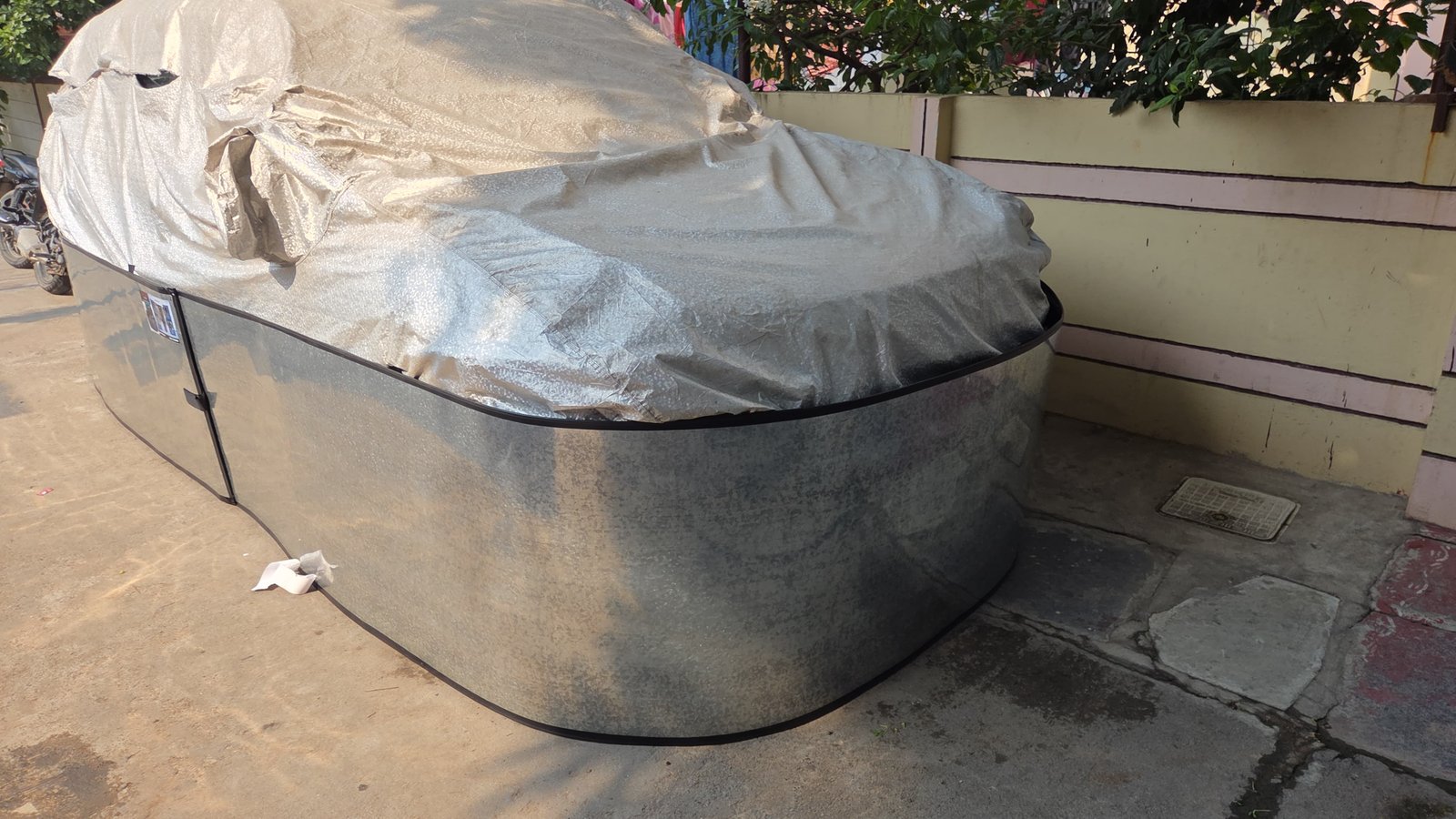 Car-lungi customer installation - GI sheet barrier protecting car from rats